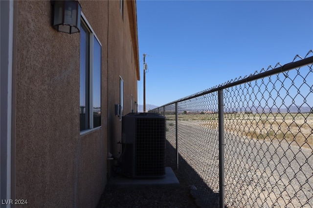 view of side of property featuring central AC unit