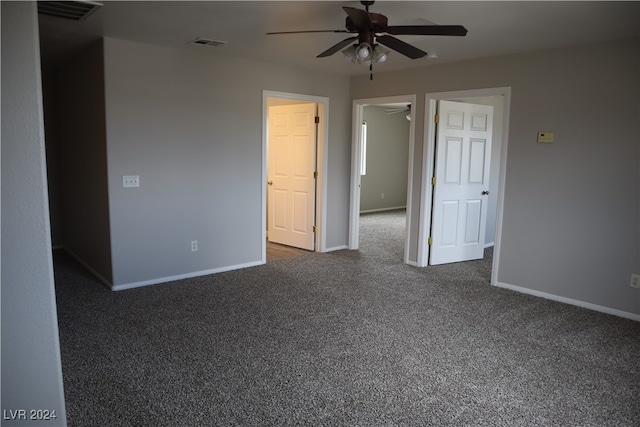 interior space with ceiling fan and carpet floors