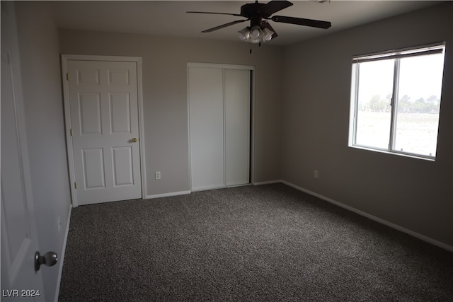 unfurnished bedroom featuring carpet floors and ceiling fan