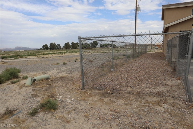 view of yard with a rural view