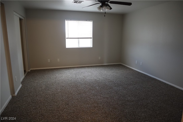 carpeted empty room with ceiling fan