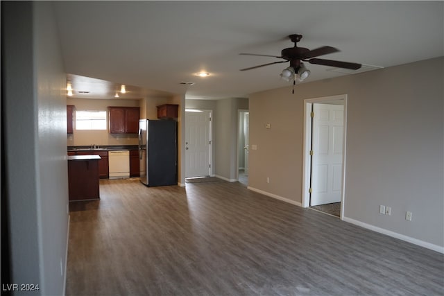 interior space with dark hardwood / wood-style flooring, sink, and ceiling fan