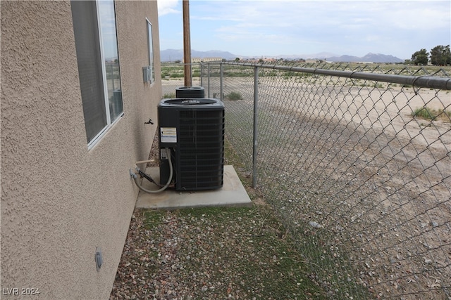 details featuring a mountain view and cooling unit