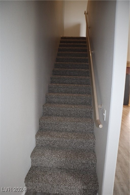 stairs featuring carpet