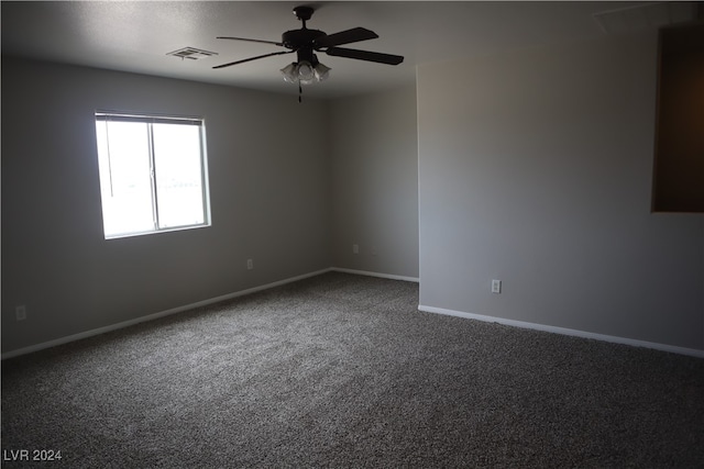 unfurnished room with ceiling fan and carpet