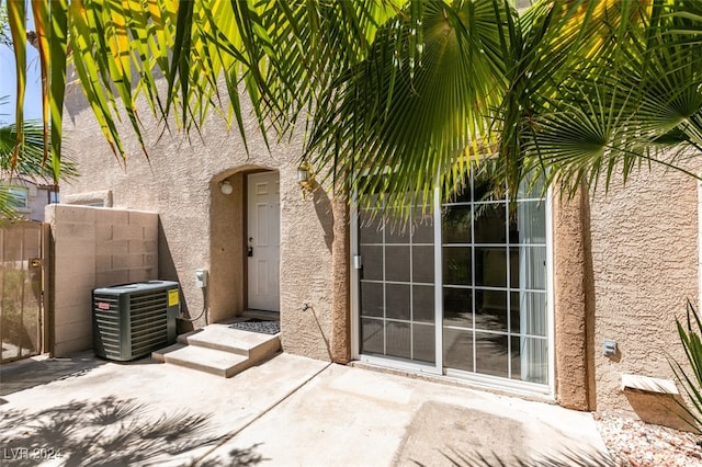 exterior space featuring cooling unit and a patio