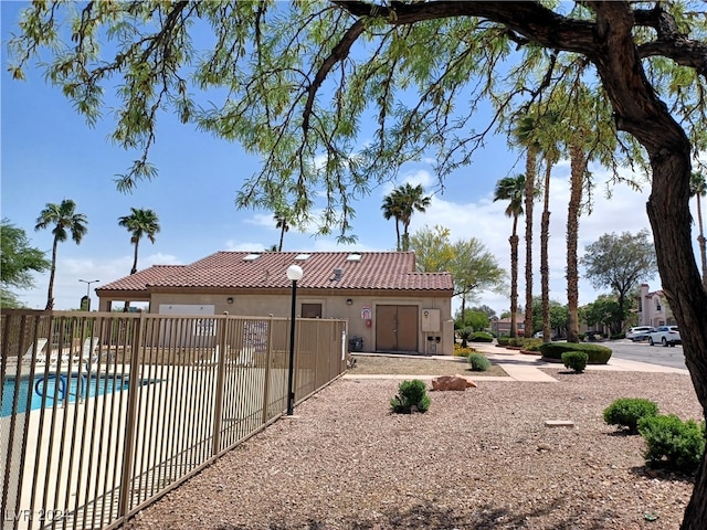 back of property with a community pool