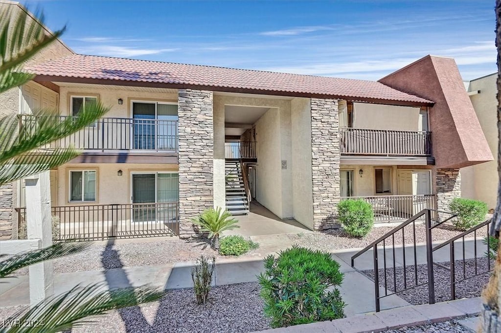 view of front of home with a balcony