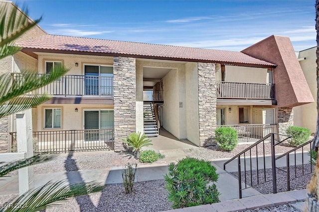 view of front of home with a balcony