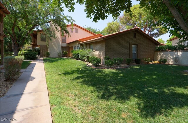 exterior space with a front lawn