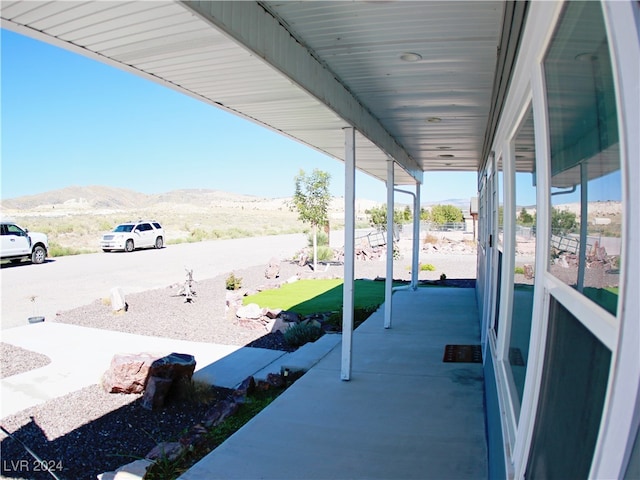 view of patio / terrace with a mountain view