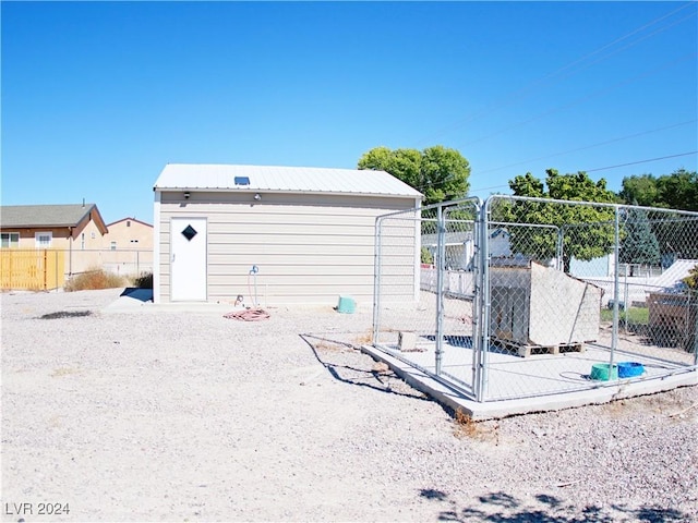 view of outbuilding with an outbuilding and fence