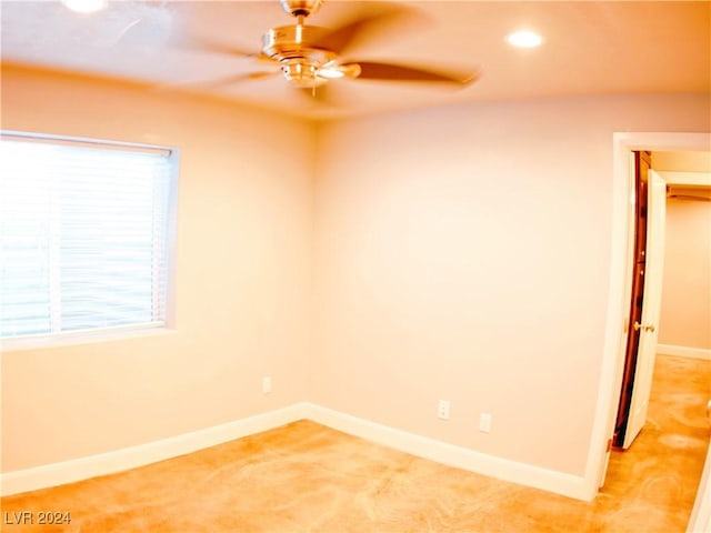 spare room featuring recessed lighting, baseboards, light carpet, and a ceiling fan