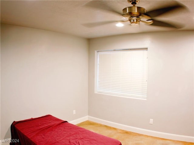 bedroom with a ceiling fan and baseboards