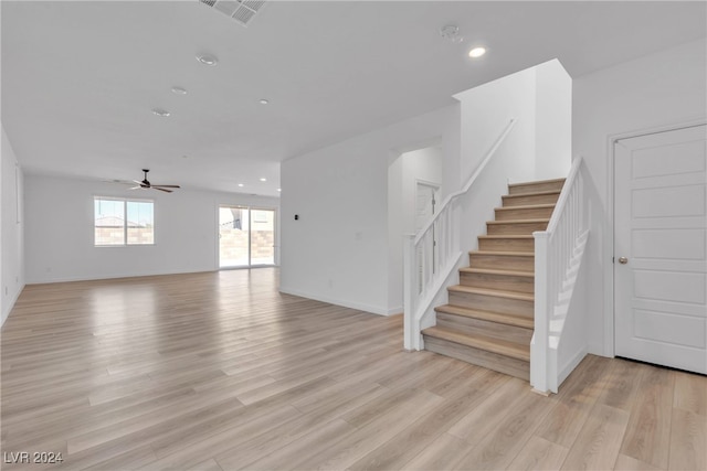 interior space with ceiling fan and light hardwood / wood-style floors