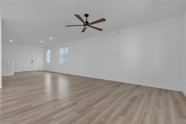 empty room featuring ceiling fan and light wood-type flooring