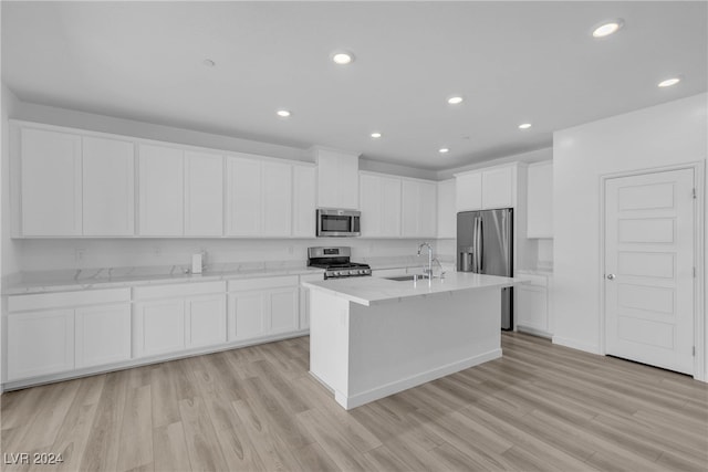 kitchen featuring light hardwood / wood-style flooring, stainless steel appliances, white cabinetry, and sink