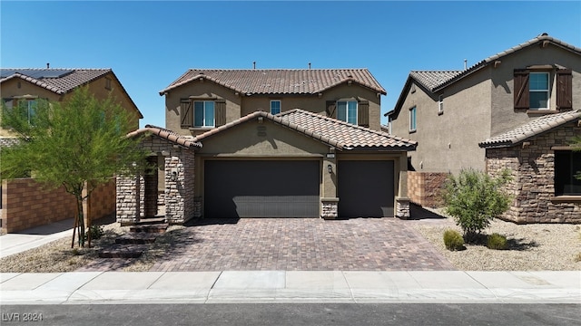 view of front of property with a garage