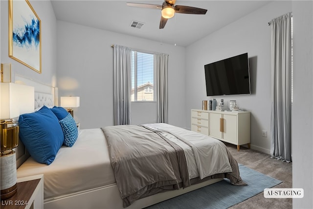 bedroom with ceiling fan and carpet floors