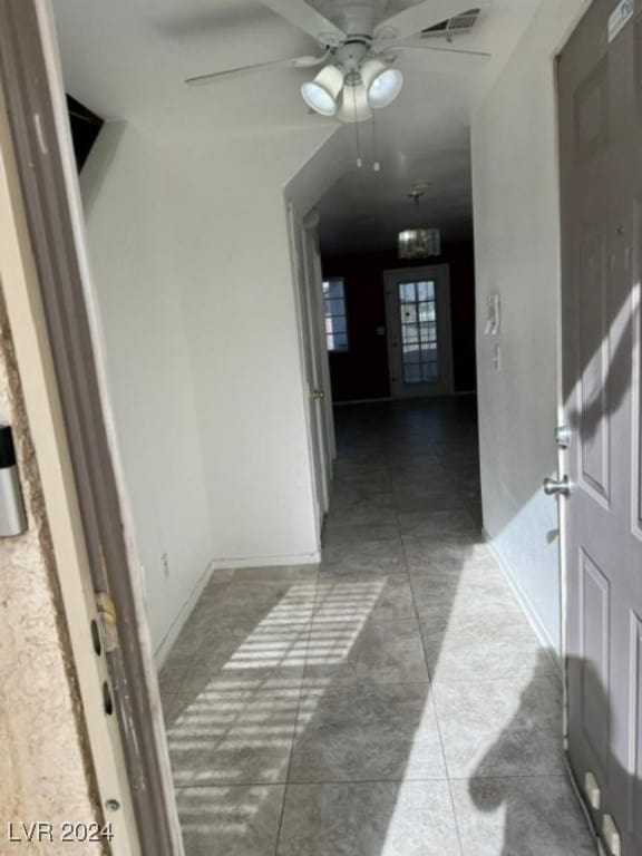 hall featuring tile patterned flooring