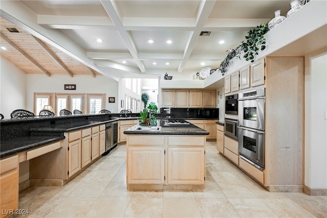 kitchen with light tile patterned floors, tasteful backsplash, a kitchen island, and beam ceiling