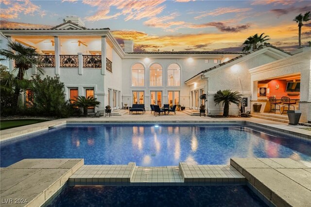 view of swimming pool with a patio area