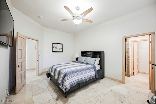 tiled bedroom with ceiling fan