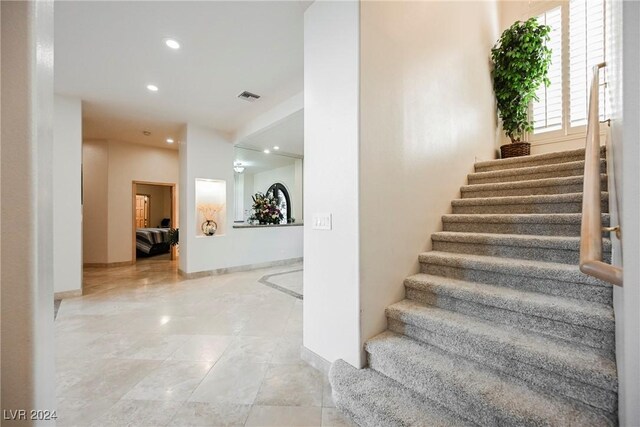 stairway featuring tile patterned floors