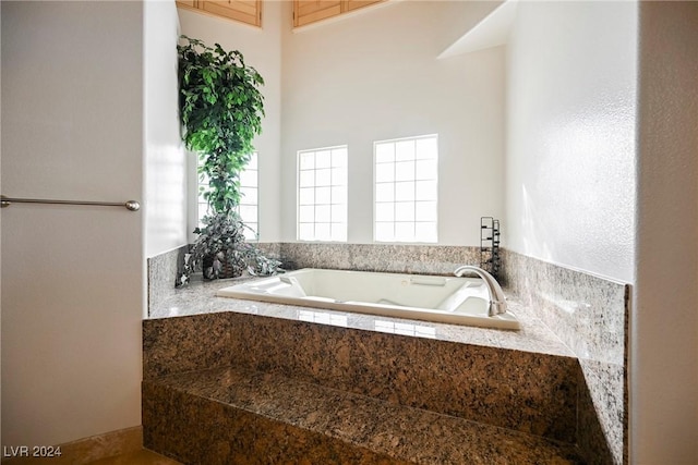 bathroom with a garden tub