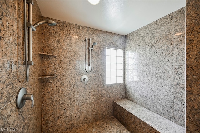 bathroom featuring tiled shower