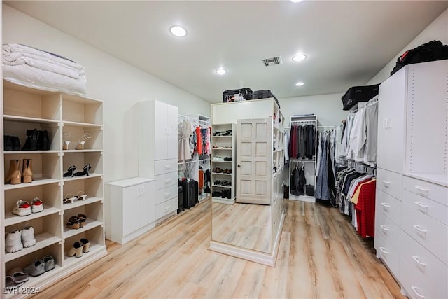 walk in closet featuring light wood-style floors and visible vents