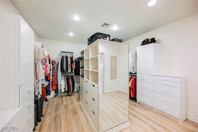 walk in closet featuring light wood-style flooring and visible vents