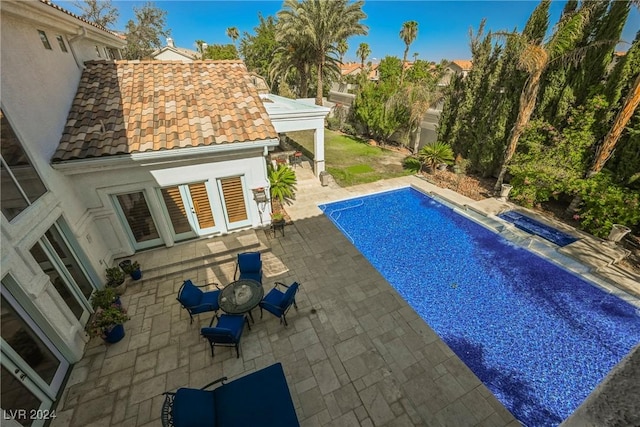 pool with a patio