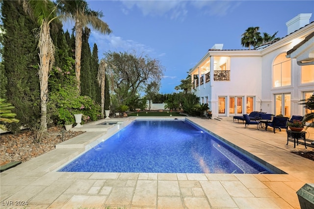 view of swimming pool featuring a patio and pool water feature