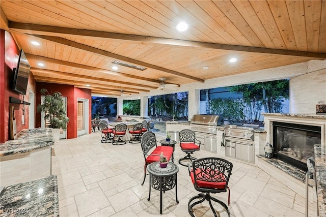 view of patio / terrace with ceiling fan, outdoor dining area, and area for grilling