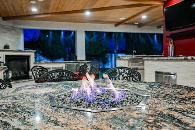 view of patio / terrace featuring an outdoor fire pit