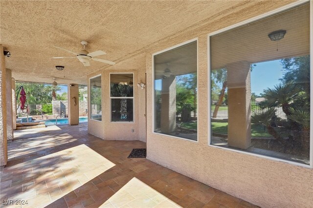 view of patio featuring ceiling fan