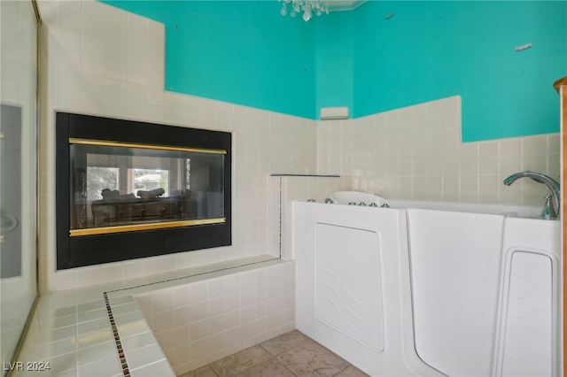 bathroom featuring tile walls and tile patterned flooring