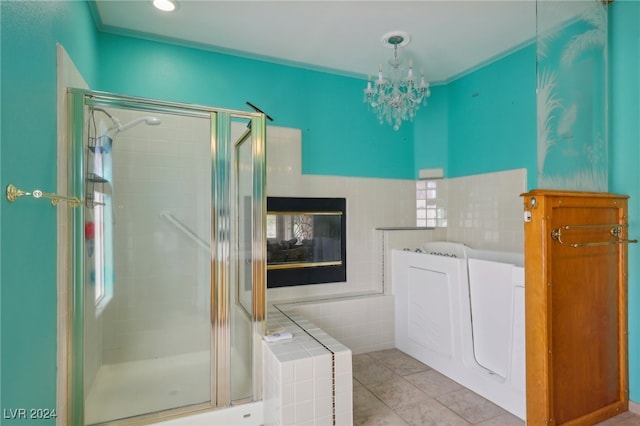 bathroom featuring shower with separate bathtub, tile patterned flooring, a chandelier, a multi sided fireplace, and ornamental molding