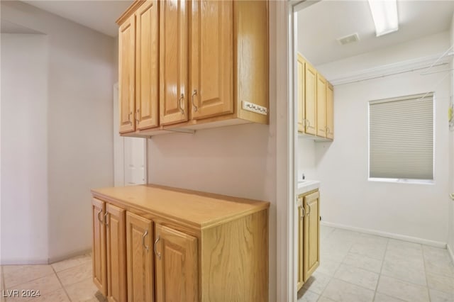 kitchen with light tile patterned floors