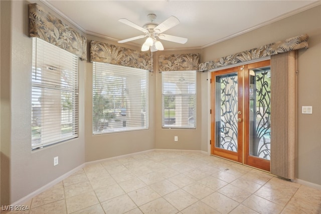 entryway featuring ceiling fan, crown molding, and a wealth of natural light