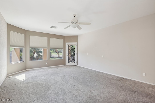 carpeted empty room with ceiling fan