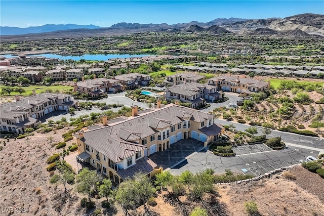 bird's eye view with a water and mountain view and a residential view