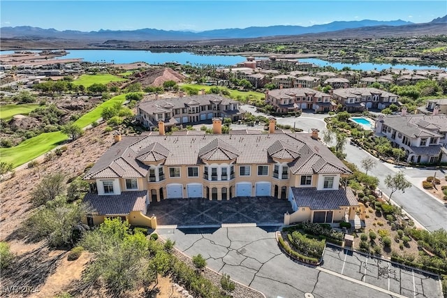 birds eye view of property featuring a water and mountain view and a residential view