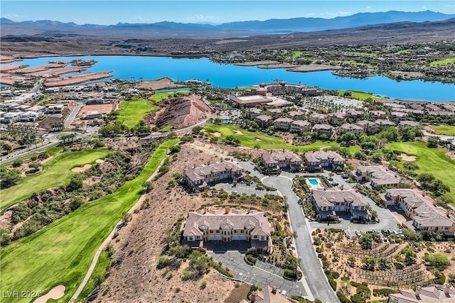 bird's eye view with view of golf course and a water and mountain view