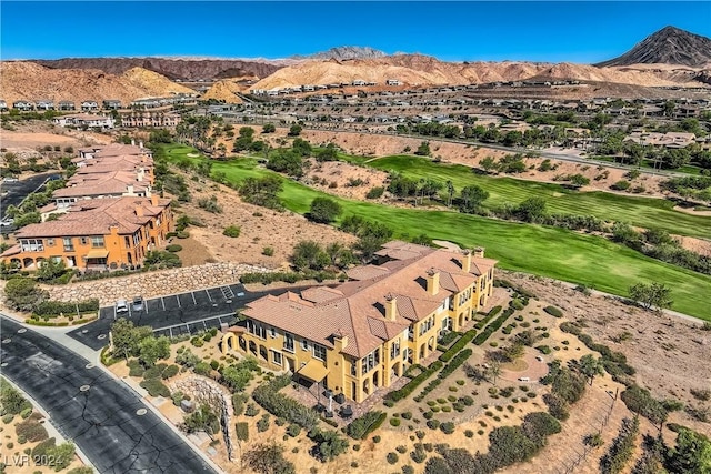 bird's eye view featuring golf course view and a mountain view