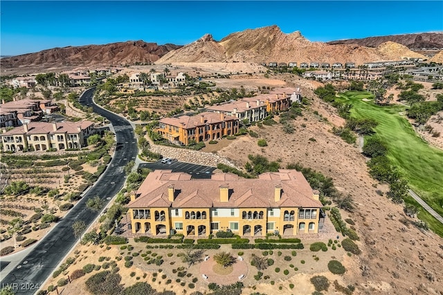 birds eye view of property with a mountain view