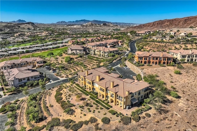 drone / aerial view featuring a residential view and a mountain view