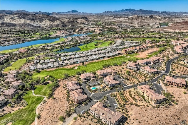 birds eye view of property with a water and mountain view