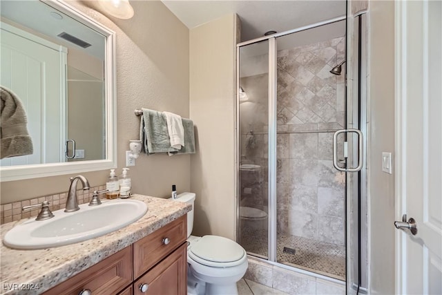 bathroom with tile patterned flooring, vanity, toilet, a stall shower, and visible vents